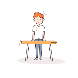 A person with a stained shirt standing at a table.